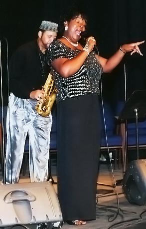 Sandra Simmons and Wayne Preston on stage.