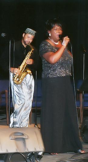 Sandra Simmons and Wayne Preston on stage.